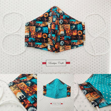 Load image into Gallery viewer, Halloween Face Mask - Removable Nose Wire - Filter Pocket - Adjustable Elastic Ties - Pumpkin Print - Turquoise Polka Dot Lining - BoutiqueCrafts
