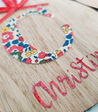 Load image into Gallery viewer, Personalised Christmas Oak Veneer Ornament - Liberty Print Inital and Red Holographic Vinyl - Red Ribbon Trims - BoutiqueCrafts