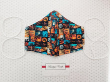 Load image into Gallery viewer, Halloween Face Mask - Removable Nose Wire - Filter Pocket - Adjustable Elastic Ties - Pumpkin Print - Turquoise Polka Dot Lining - BoutiqueCrafts
